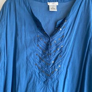 Beautiful blue with ruffled hem. Very cute on.